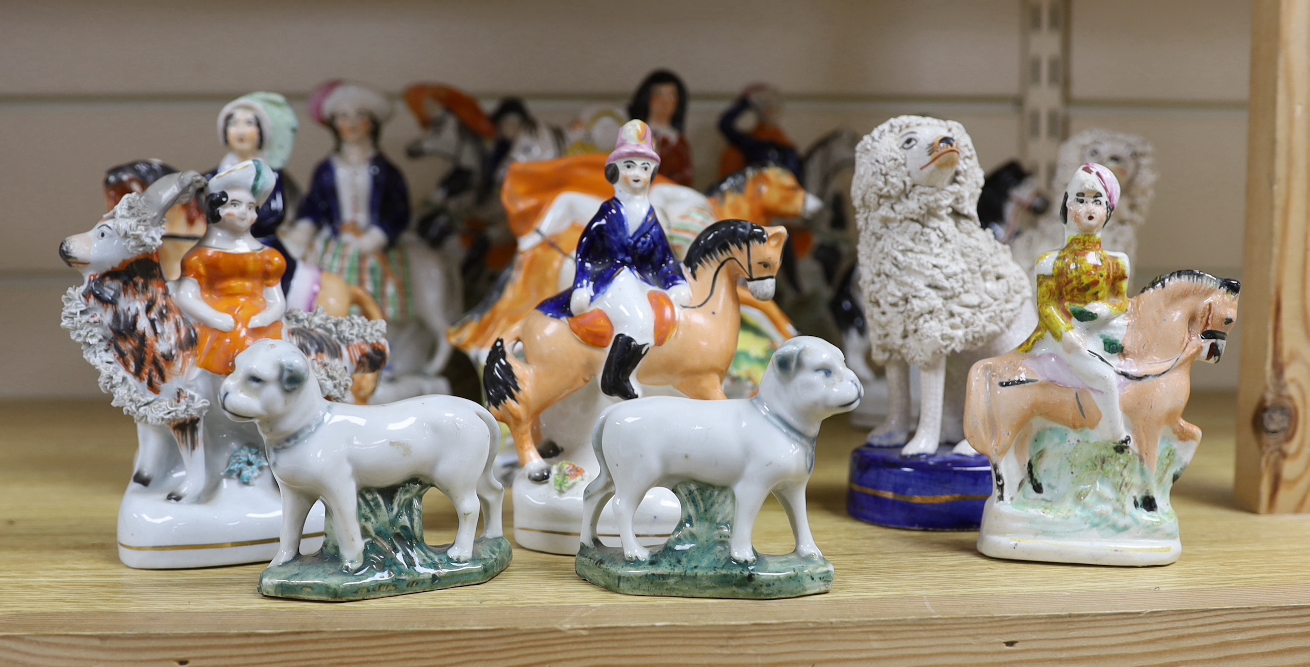 Nine Victorian Staffordshire figures or groups, three reproductions and a pair of Continental porcelain figures of dogs, tallest 17.5cm